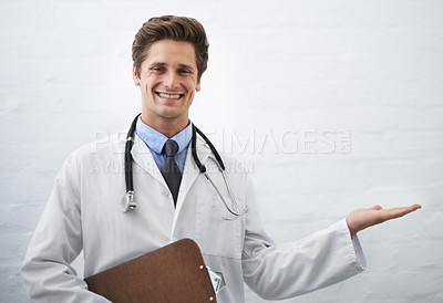 Buy stock photo Happy man, portrait and doctor palm for advertising or marketing in healthcare on a white studio background. Male person, nurse or medical surgeon smile with hand out for presentation on mockup space