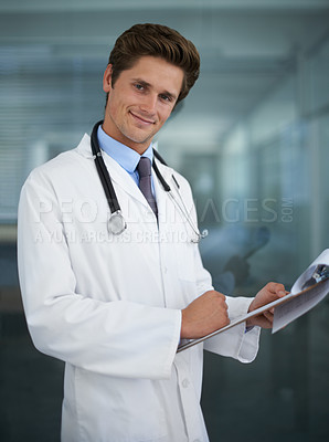 Buy stock photo Clipboard, happy and portrait of doctor in his office for diagnosis or treatment at medical hospital. Checklist, career and professional young male healthcare worker reading in medicare clinic.