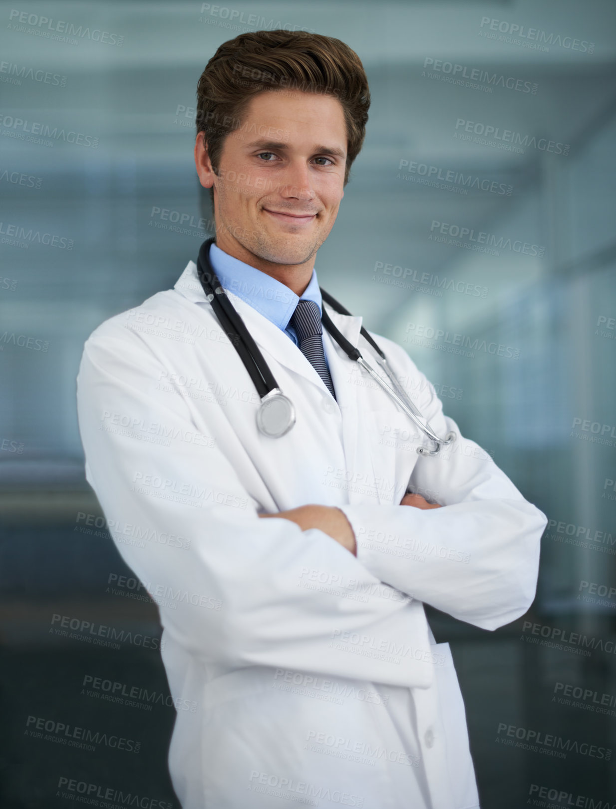 Buy stock photo Confident, crossed arms and portrait of man doctor with stethoscope for positive, good and confident attitude. Happy, pride and young male healthcare worker in medical office of hospital or clinic.