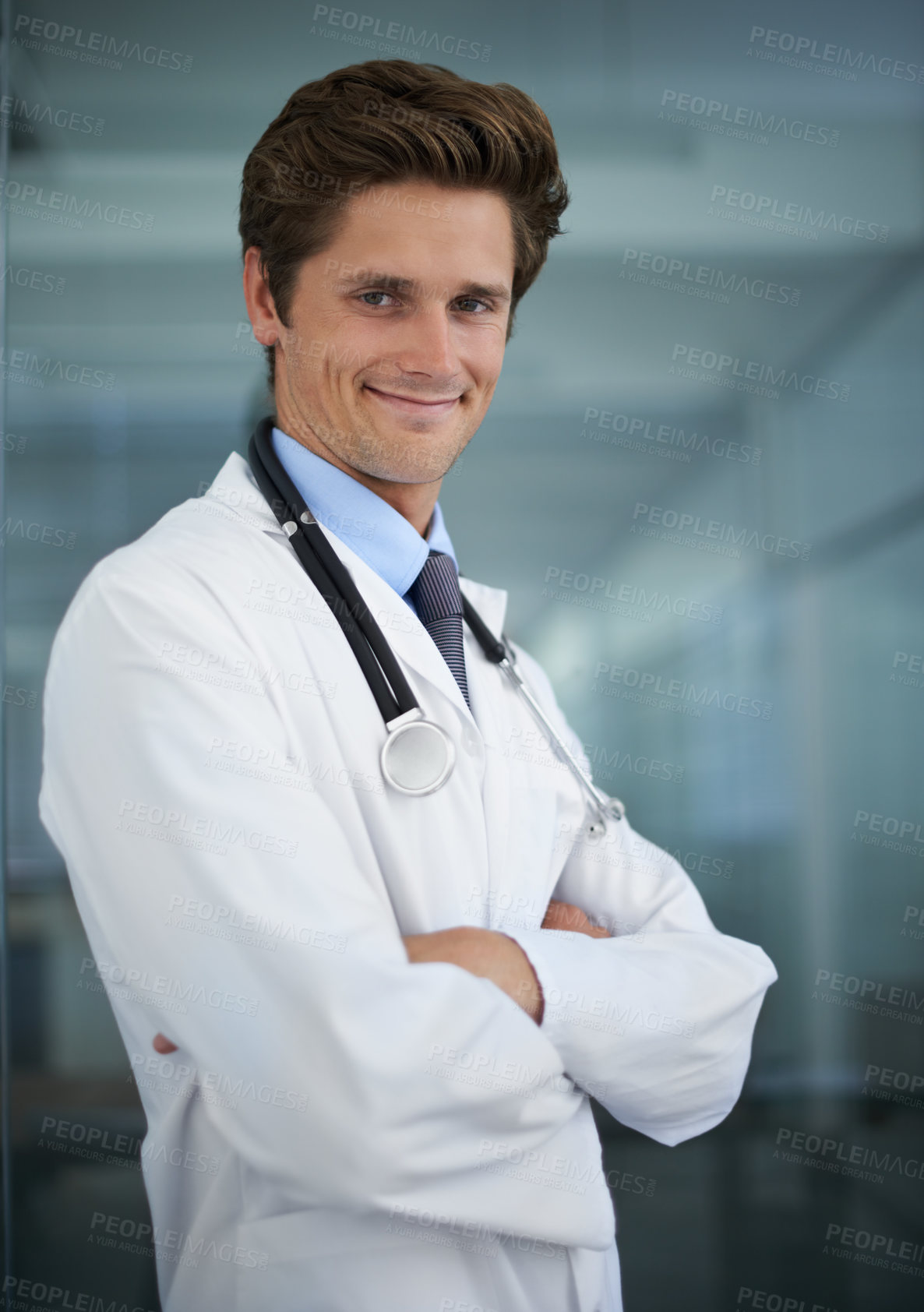 Buy stock photo Happy, crossed arms and portrait of man doctor with stethoscope for positive, good and confident attitude. Smile, pride and young male healthcare worker in medical office of hospital or clinic.