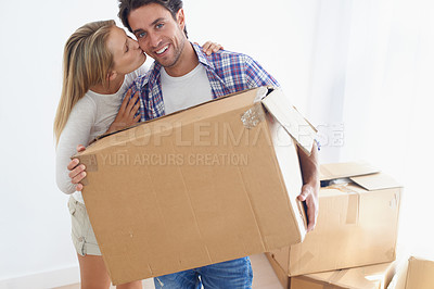 Buy stock photo Couple, boxes and smile with kiss for real estate, new home or property investment with romance or love. Moving, man and woman with happy, hug or embrace for fresh start, achievement and dream house