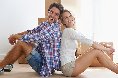 Buy stock photo Apartment, happiness and couple moving boxes in new home, property and sitting on floor. Building, man and woman for purchase, real estate and mortgage for relocation, new house and homeowner
