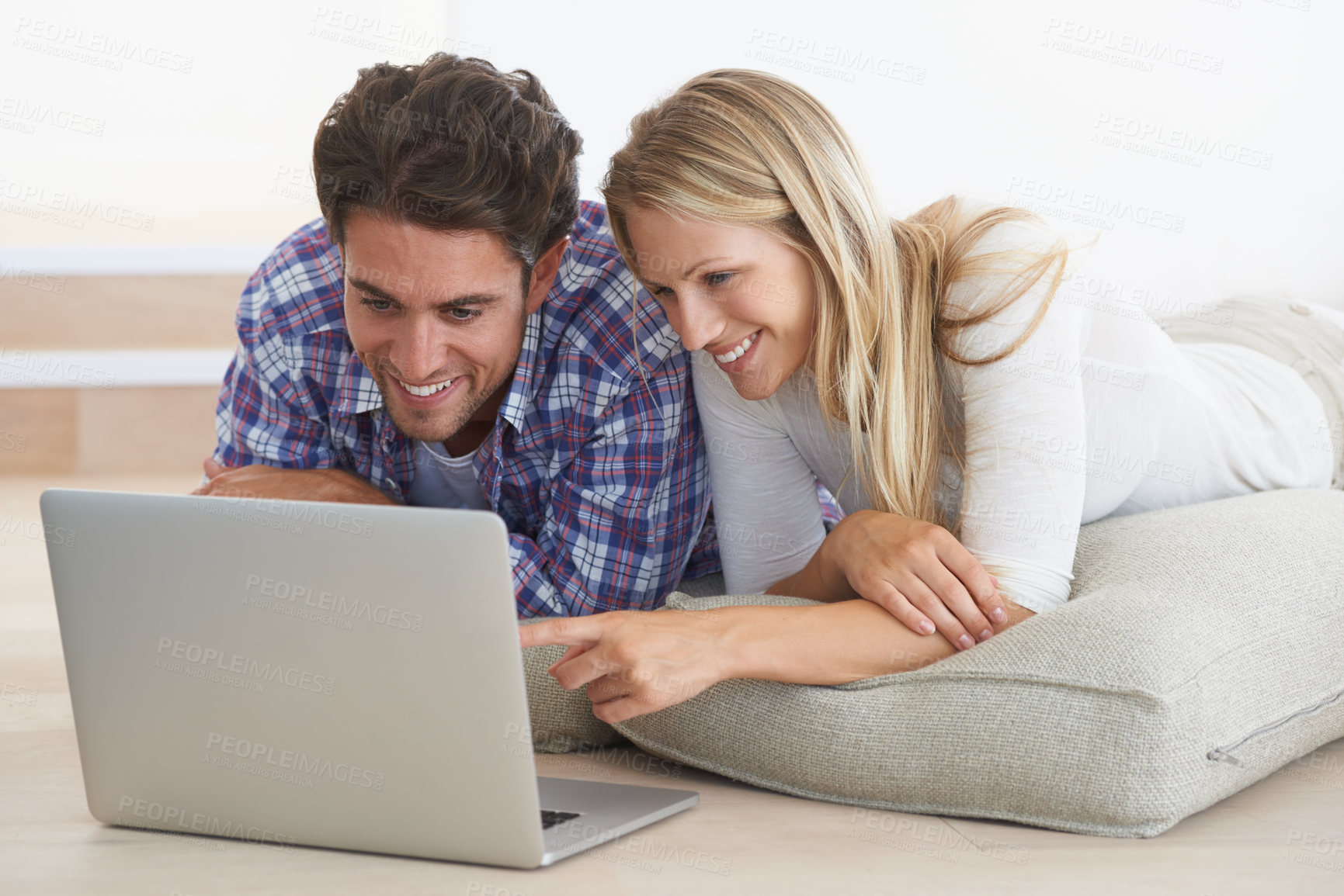 Buy stock photo Couple, happy and laptop on floor in home for movie, social media or web streaming with bonding and love. Technology, man or woman on ground with computer pc for internet scroll and tv show for care 