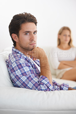 Buy stock photo Man, angry and living room couch with disagreement, upset and thinking with anger, fight or mad. Divorce, betrayal and relationship with cheating, stress and argument for marriage, home and woman