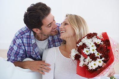 Buy stock photo Man, flowers and surprise in home, happy woman and hug boyfriend for anniversary celebration. Birthday gift, romance and bouquet for love, present and valentines day with romantic gesture and smile

