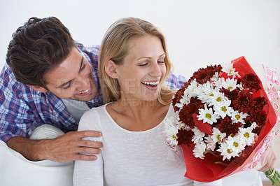 Buy stock photo Wow, surprise or happy couple with flowers in home with hug or care for anniversary celebration. Giving a gift, romance or bouquet for love, present and valentines day with romantic gesture and smile