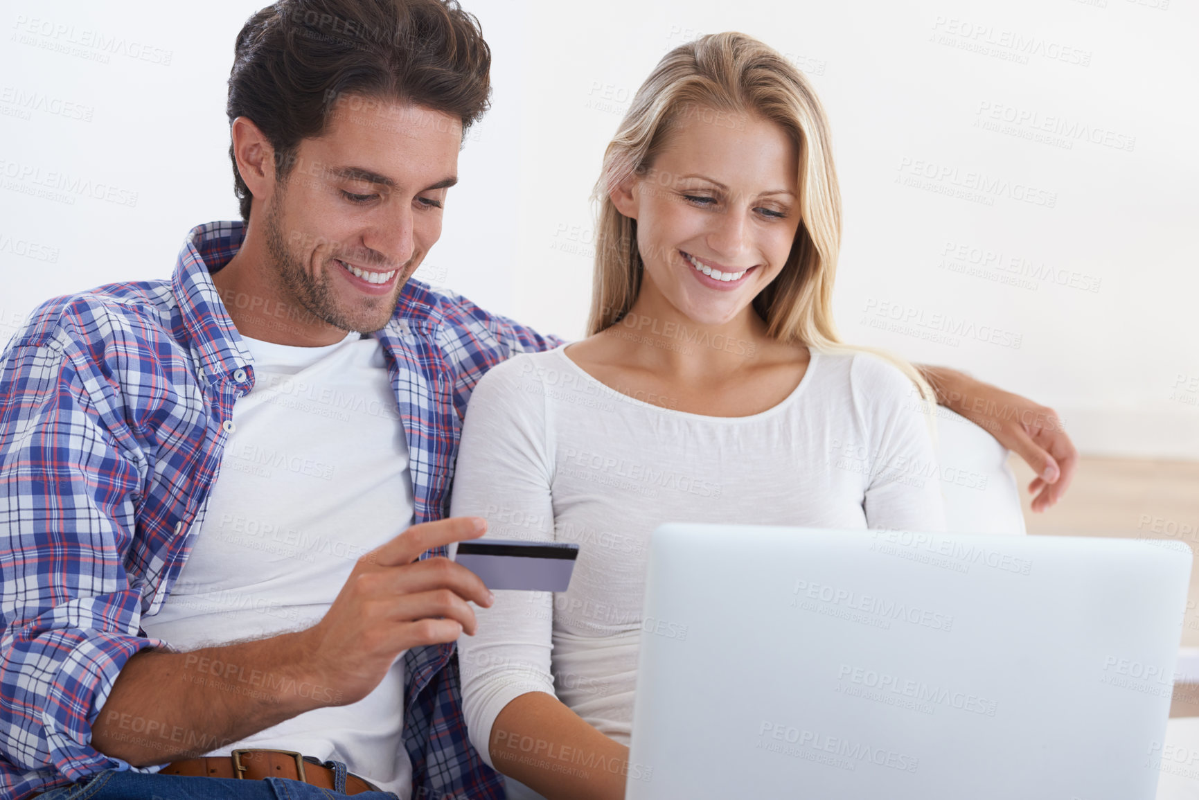 Buy stock photo Happy couple, laptop and credit card for online shopping, payment or banking together in relax at home. Man and woman smile with debit on computer for ecommerce, transaction or fintech at house