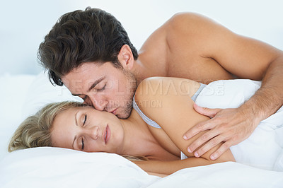 Buy stock photo Man, kiss or woman sleeping in bed for fatigue, peace or dreaming to relax on holiday vacation. Couple, romantic love or tired wife on break enjoying nap, bedroom sleep or resting at night in home 