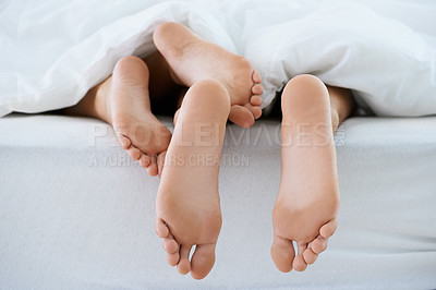 Buy stock photo Couple, morning or feet with blanket in sleeping for peace or rest together on weekend in a house. Wellness, comfort or closeup of barefoot people in home for bond, care or nap under duvet in bedroom