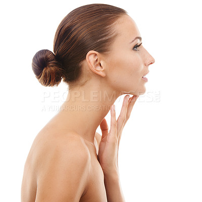 Buy stock photo Beautiful young woman touching her face while isolated against a white background