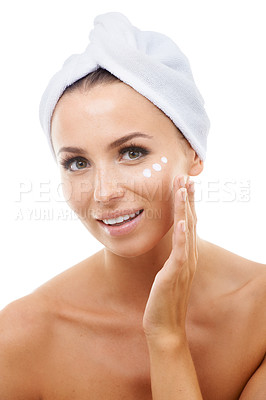 Buy stock photo Portrait of model, white background or face cream for skincare, beauty or cosmetics in studio. Apply, towel or female person with product, wellness or glow for lotion, dermatology or facial treatment