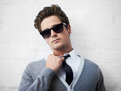 Buy stock photo Face, fashion and sunglasses with cool man in studio on white background for attitude or style. Portrait, shades and tie with confident young person or model in casual or trendy clothes outfit