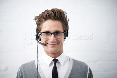 Buy stock photo Business man, telemarketing and headphones in portrait, smile and microphone by wall background. Call center employee, worker or person with mic, pride and contact us with voip for technical support