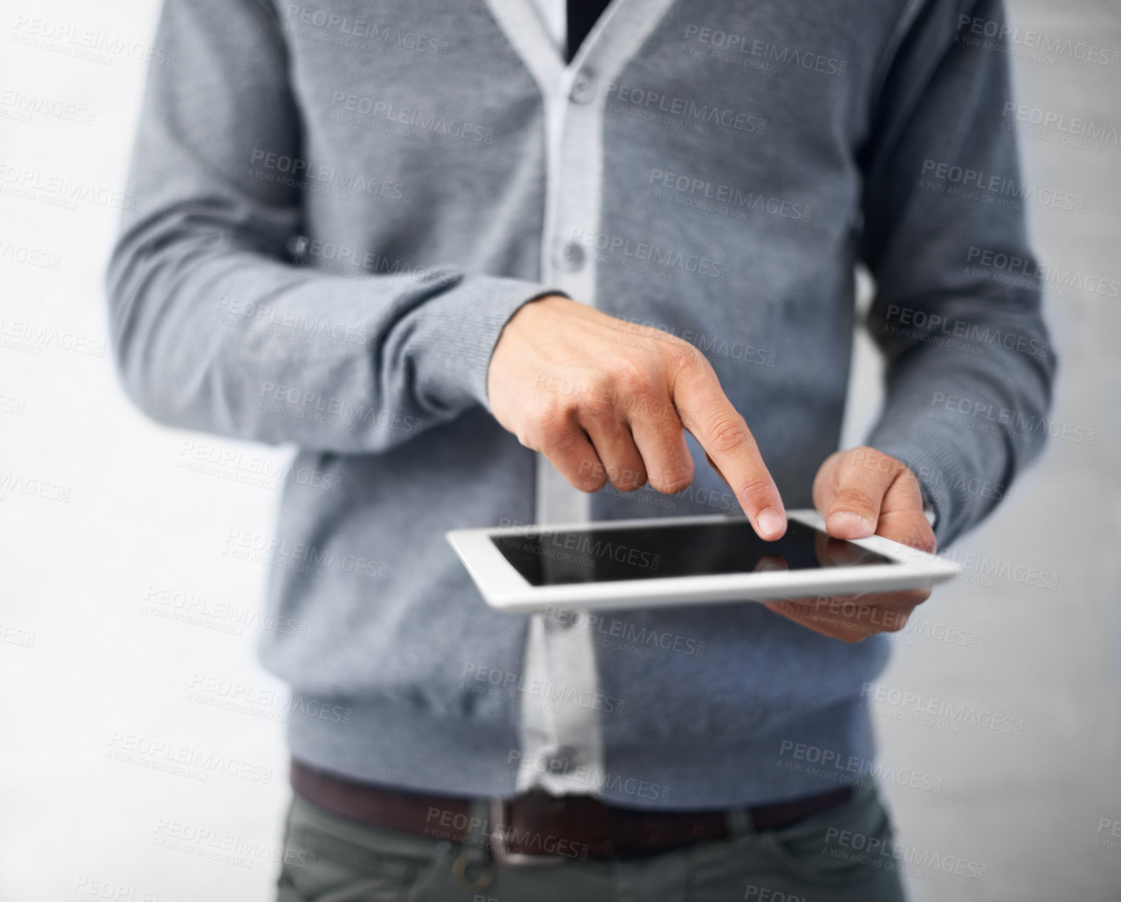 Buy stock photo Person, hands and tablet for research, UI or UX in social media, communication or networking on a gray studio background. Closeup of creative employee touching technology for startup on mockup space