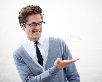Buy stock photo Man, hand and businessman in fashion, smile and offering for work, professional and employee. Product placement, marketing geek and pointing as manager and business attire of person in corporate wear