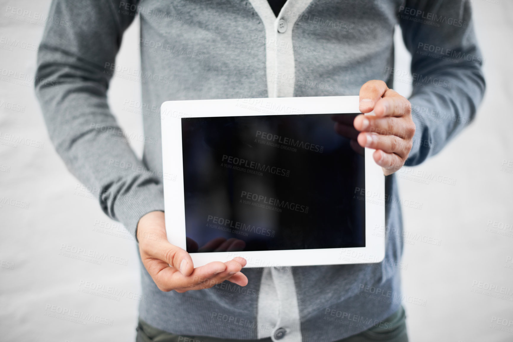 Buy stock photo Cropped image of a nerd holding a digital tablet