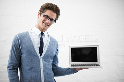 Buy stock photo Happy man, portrait and laptop screen for advertising or marketing on a gray studio background. Male person, nerd or geek smile with computer, tech display or mockup space for advertisement, UI or UX