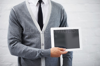 Buy stock photo Man, hands and screen on tablet in advertising or marketing against a gray studio background. Closeup of male person or employee showing technology display or mockup space for advertisement, UI or UX