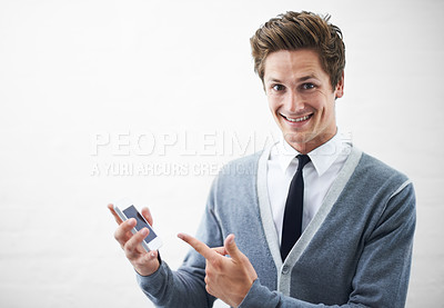 Buy stock photo Business man, show phone and studio portrait with mockup space, pointing or happy by white background. Person, entrepreneur and tech startup employee in presentation, choice and smartphone with pride