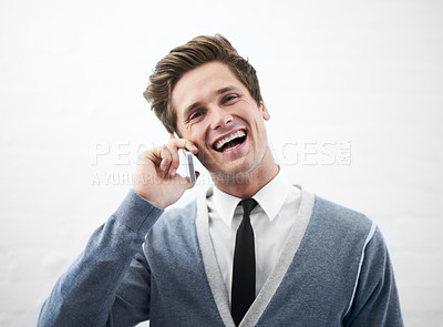 Buy stock photo Happy man, phone call and laughing for funny joke, conversation or meme on a gray studio background. Face of young handsome person smile for fun business discussion, humor or comedy on mockup space