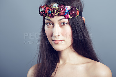 Buy stock photo Woman, portrait and flower headband in hair with beauty, skin glow and wellness on grey background. Face, hairstyle with floral head gear or accessory, dermatology and cosmetics to blossom in studio