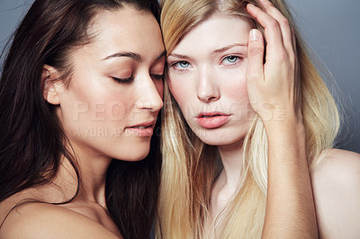 Buy stock photo Beauty, face and portrait of women couple in studio for natural skin care, cosmetics and makeup. Lgbtq, gay or lesbian people together on a grey background for self love, dermatology and glow