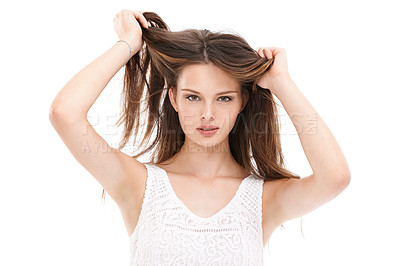 Buy stock photo Portrait, hair and beauty with a model woman in studio on a white background for keratin treatment at a salon. Face, haircare and natural aesthetic with a young female holding her straigh hair