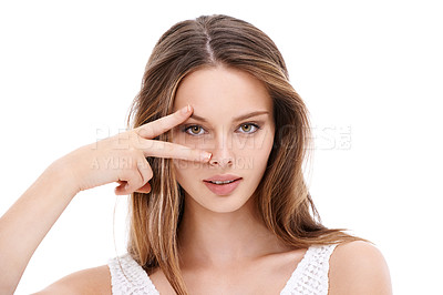 Buy stock photo Portrait, hand and eyes with a model woman in studio on a white background with her fingers on her face. Microblading, eyecare and beauty with an attractive young female posing to promote cosmetics