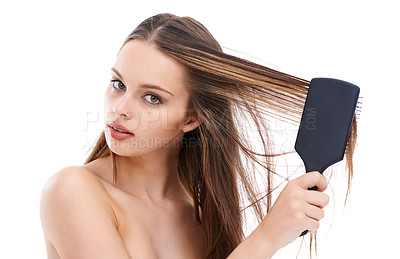 Buy stock photo Beautiful, young and woman brushing hair for self love and self care or hygiene against a white studio background. Portrait of isolated attractive female using brush for haircare or hair treatment