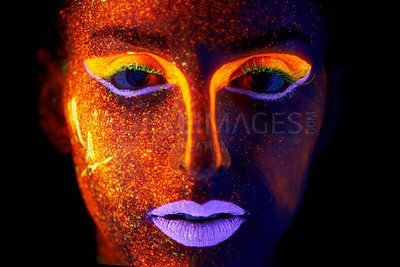Buy stock photo Portrait, art and beauty with neon woman on black background for makeup, glitter or colorful glow. Face, fantasy and creative with confident young person in the dark for psychedelic or techno paint