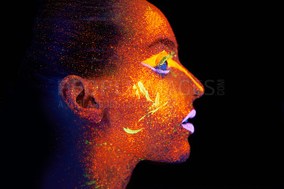 Buy stock photo Art, woman and profile with neon paint on face and beauty, bright lipstick and creative skincare on dark background. Orange glow, disco aesthetic and model in studio for creativity with makeup