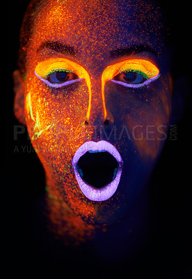 Buy stock photo A young woman with with neon paint on her face