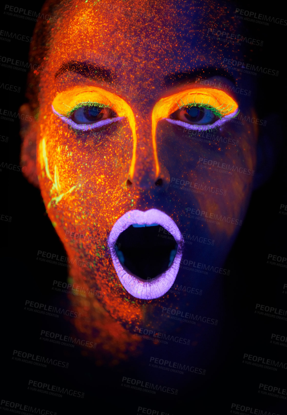 Buy stock photo A young woman with with neon paint on her face