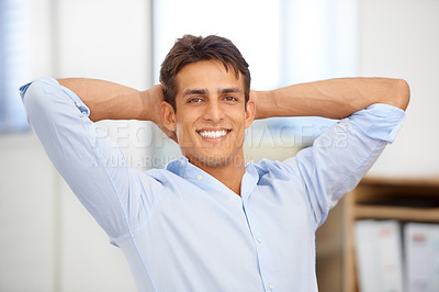 Buy stock photo Portrait, relax or happy man in workplace on break for mental health, pride or wellness at desk. Calm, freedom or male employee with smile or hand behind his head in a business stretching or resting