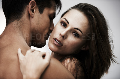 Buy stock photo Couple, hug and touch with skin in studio, topless and sensual with moment isolated on white background. People hug, fashion or beauty with intimacy, wellness and embrace with love and romance