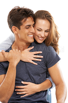Buy stock photo Happy couple, hug and love in embrace, care or compassion for trust against a white studio background. Handsome man and young woman smile for romance, affection or relationship together on mockup
