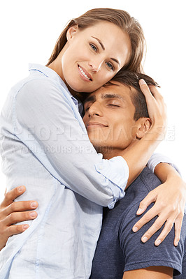 Buy stock photo A young couple embracing lovingly against a white background