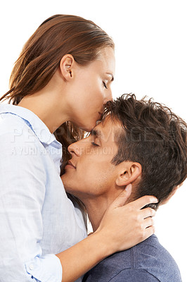 Buy stock photo Happy couple, hug and kiss for love, care or compassion in trust or embrace on a white studio background. Handsome man and woman kissing forehead for romance, affection or relationship together