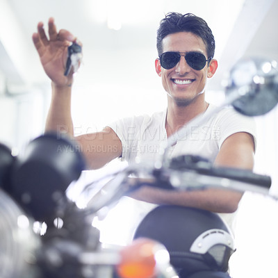 Buy stock photo Happy man, portrait and motorcycle keys with helmet and sunglasses for transportation vehicle in garage. Young male person or biker smile for cool automobile or ownership of mechanical motorbike