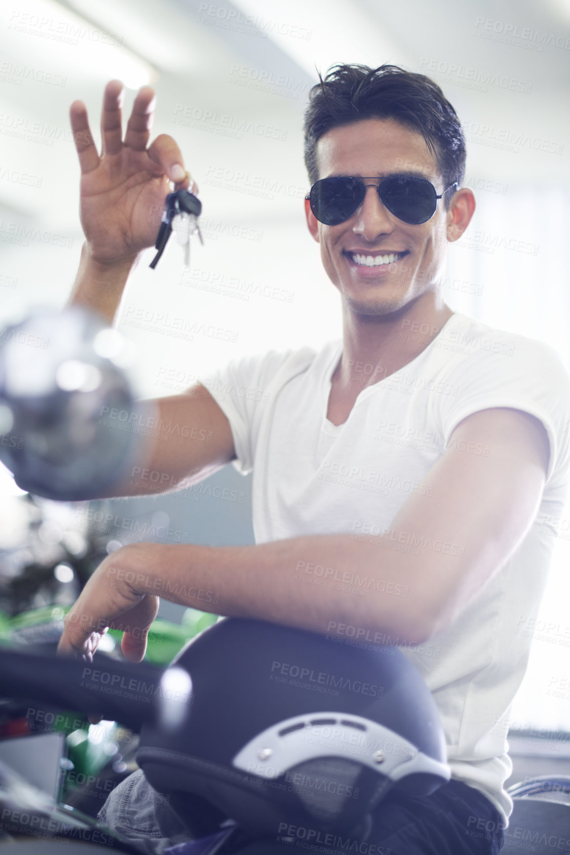 Buy stock photo Handsome man, portrait and motorcycle keys with helmet and sunglasses for transportation vehicle in garage. Young male person or biker smile for cool automobile or ownership of mechanical motorbike