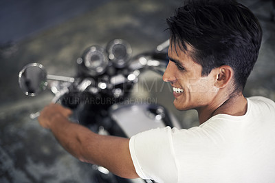 Buy stock photo Happy man, motorcycle and vehicle in garage for travel, transportation or road trip adventure. Young handsome male person or biker smile for cool automobile or ownership of mechanical motorbike