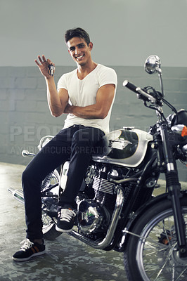 Buy stock photo Happy man, portrait and keys sitting on motorcycle keys for transportation or vehicle in garage. Young male person or biker smile for cool automobile, ownership or mechanical motorbike in parking lot