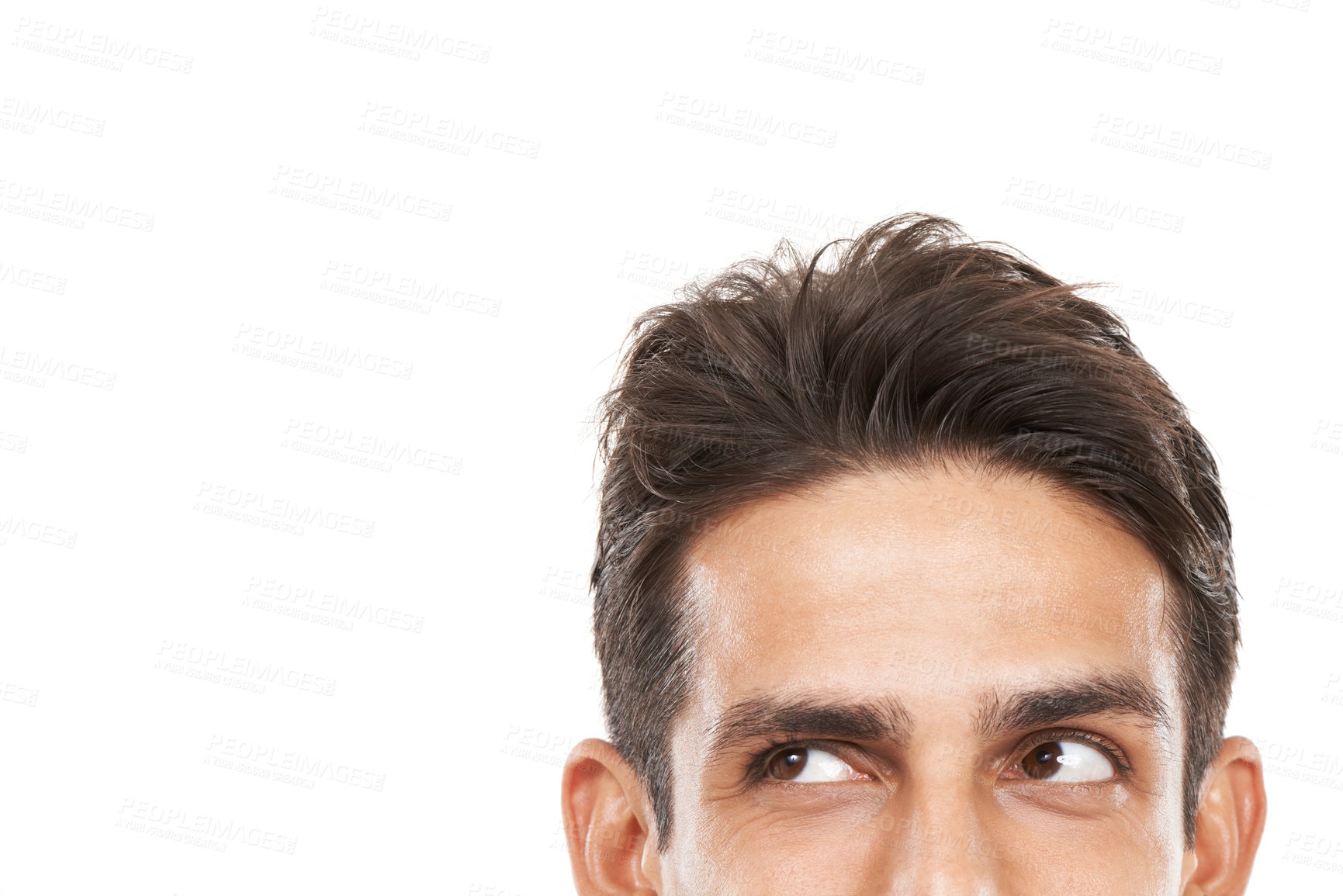 Buy stock photo Cropped shot of a young man's face looking sideways towards copyspace