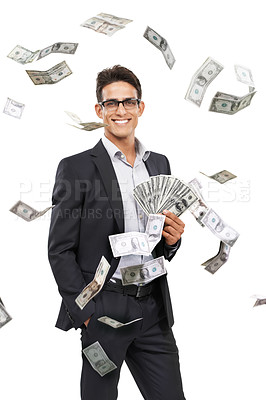 Buy stock photo Portrait of a young businessman holding cash as money falls around him