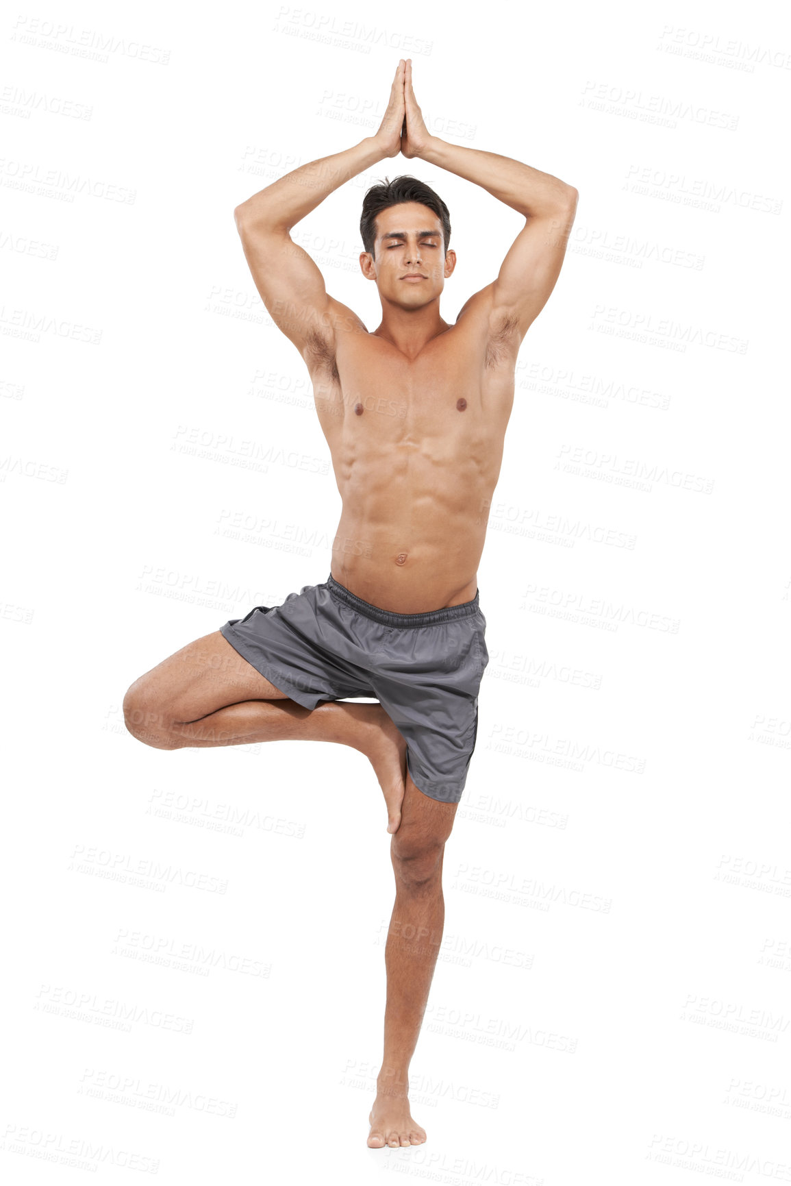 Buy stock photo Man, meditation and tree pose or yoga in studio, spiritual awareness and prayer hands. Male person, pilates and peace or wellness and healing or relaxing, fitness and balance by white background
