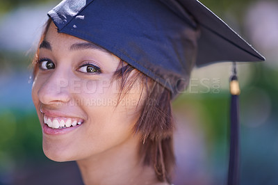 Buy stock photo Woman, graduate and college success with education, cap and gown for ceremony outdoor. Academic, smile in portrait and graduation event for achievement, higher learning and certified with pride