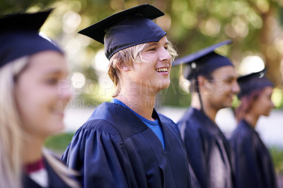 Buy stock photo Man, graduate and university achievement for education with ceremony outdoor. Students, smile and graduation event for academic success, higher learning and certification with pride and profile