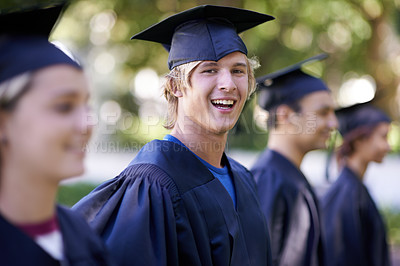 Buy stock photo Happy man, portrait and students in outdoor graduation for education, learning or qualification. Male person or graduate smile with group for higher certificate, diploma or degree at campus ceremony