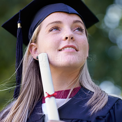 Buy stock photo Happy woman, student and certificate in graduation for qualification, education or career ambition. Face of female person or graduate smile in diploma, degree or award with vision at outdoor ceremony