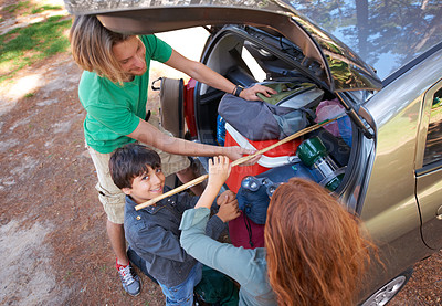 Buy stock photo Happy family, car and packing for camping road trip, holiday or vacation above in nature outdoors. Top view of dad and kids getting ready for travel, camp adventure or getaway together in the forest